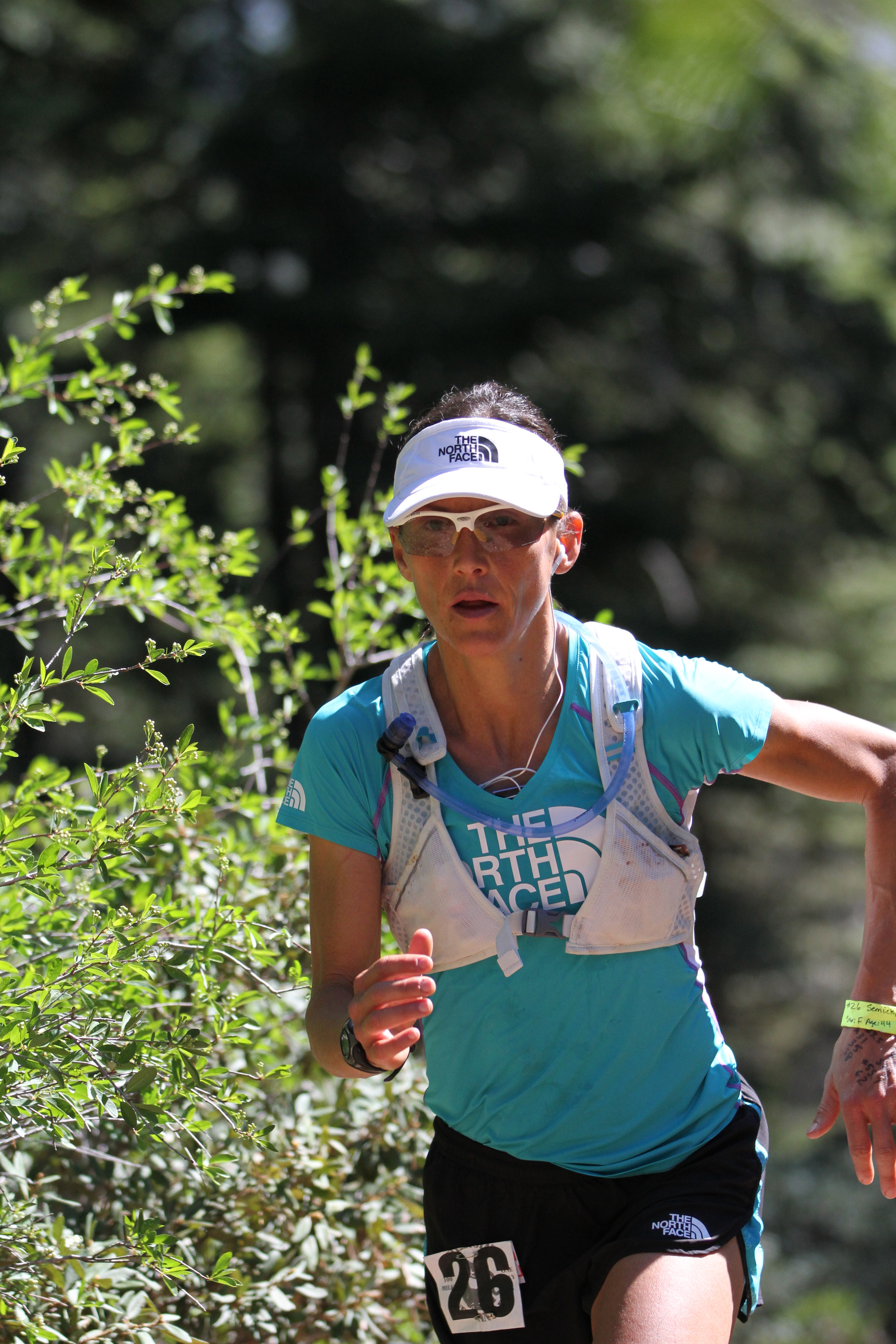 Kami Semick racing a trail ultramarathon